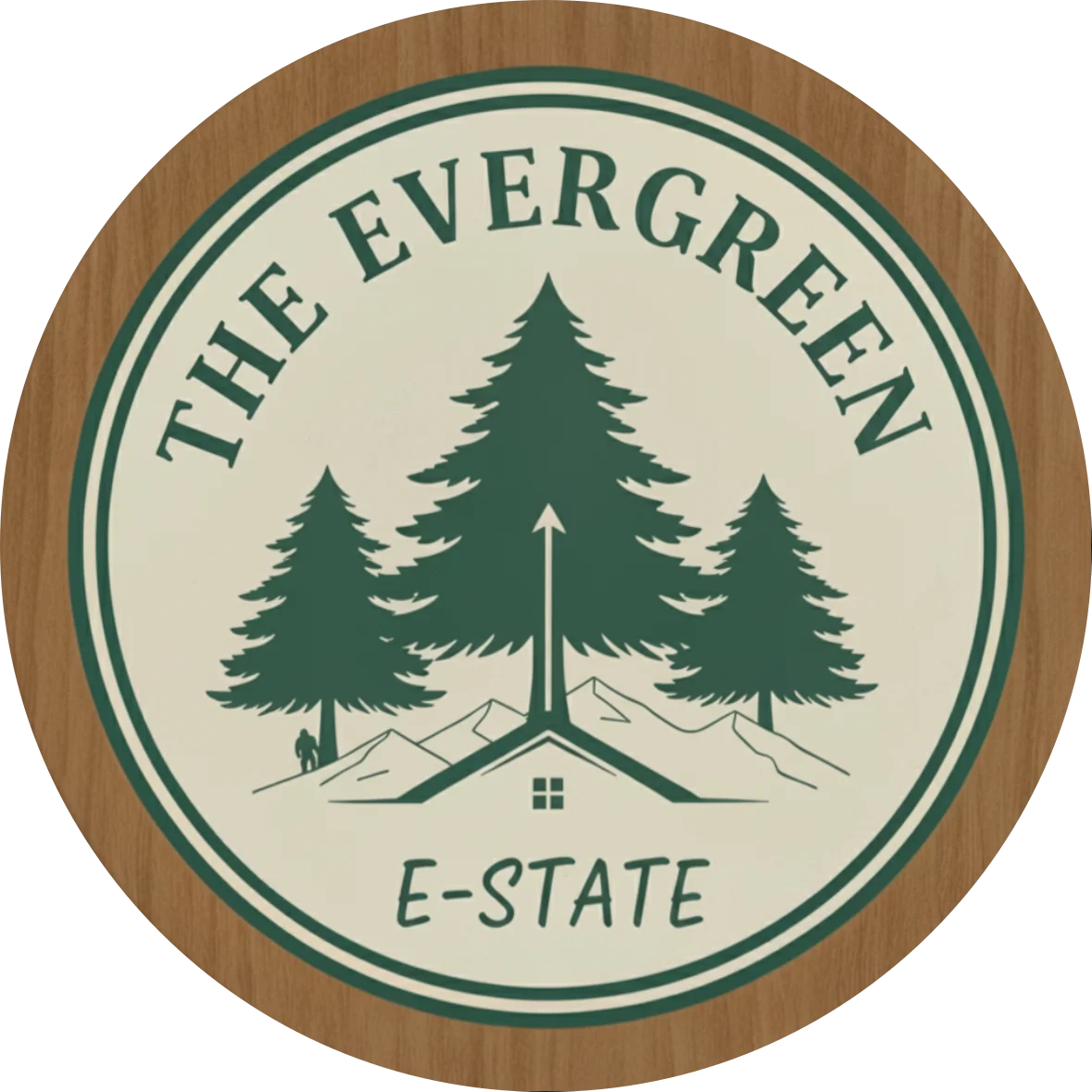 Circular logo with evergreen trees, mountains and a small house on a cream background; wood border and the text 'The Evergreen E-State'